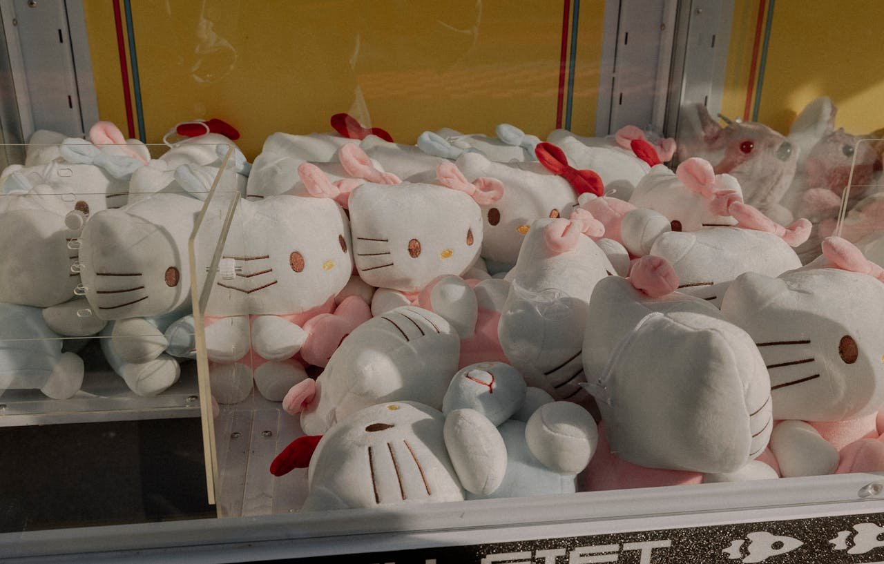Claw machine filled with adorable stuffed toys, ideal for entertainment spaces and arcades.